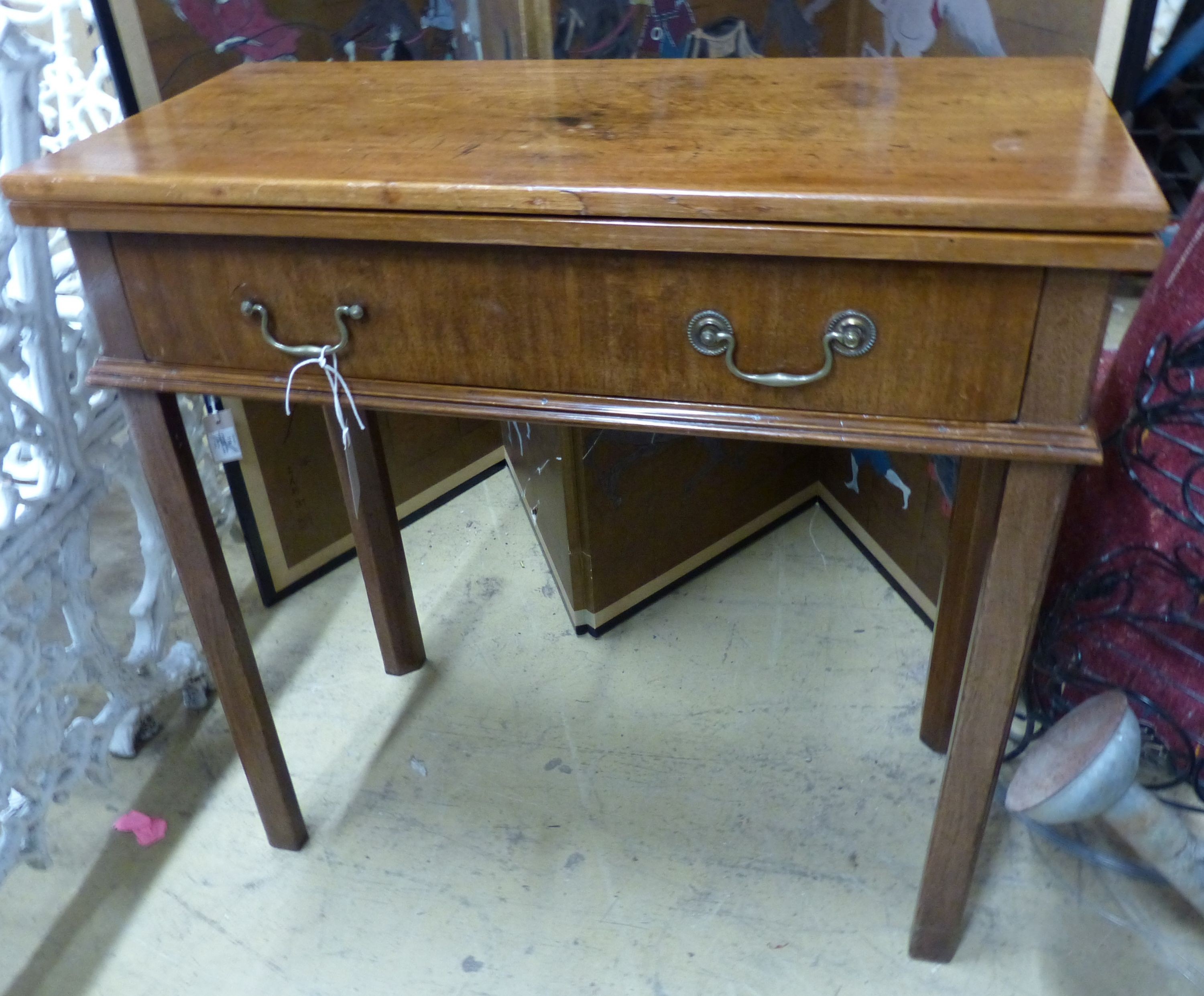 A George III rectangular mahogany folding tea table, W.74cm D.35cm H.73cm